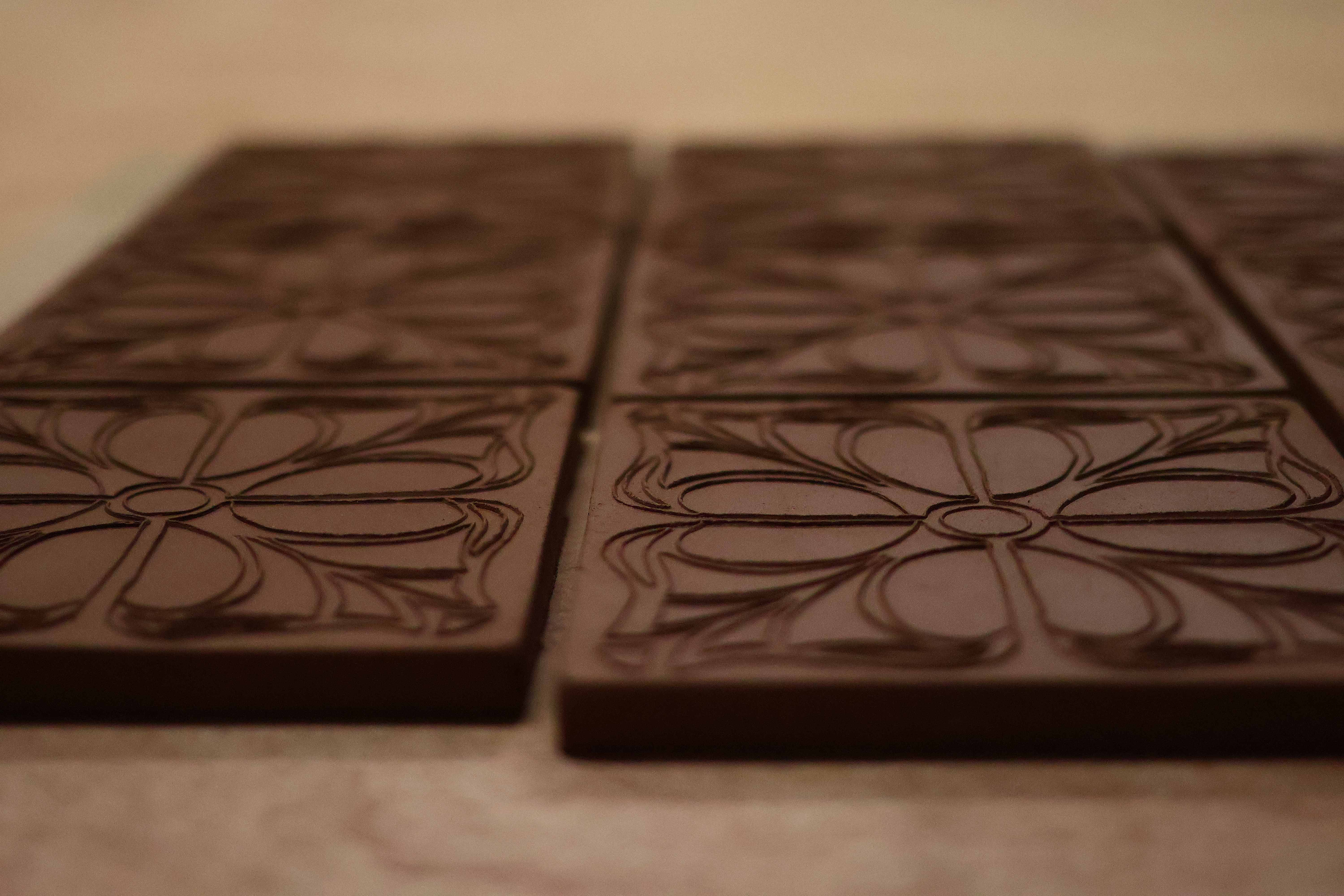 Close-up of the carved floral relief lines on a fired Courtyard tile